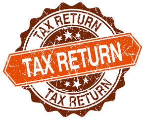 Obraz premium tax return orange round grunge stamp on white