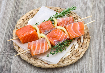 Raw salmon skewers