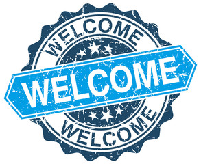 welcome blue round grunge stamp on white