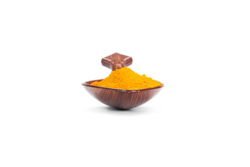  Spice in a wooden spoon isolated on white 