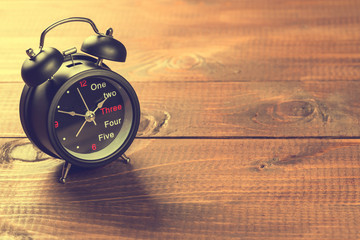 Alarm Clock On Wood Table