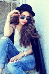 fashion model in sunglasses posing outdoor