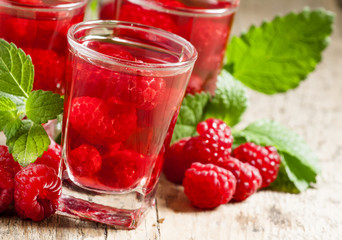 Red refreshing cocktail with raspberry and mint, selective focus