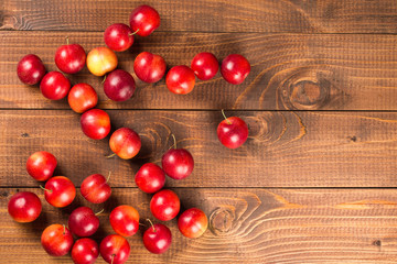 Sweet plums on wooden background