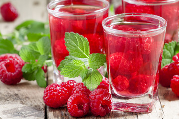 Red refreshing cocktail with raspberry and mint, selective focus