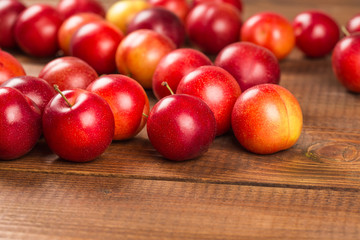 Sweet plums on wooden background