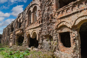 Brick destroyed wall. Remains of  building. The ruins of old for