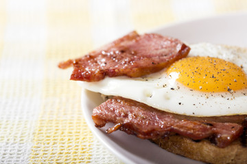 Toast with fried eggs and bacon