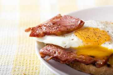 Toast with fried eggs and bacon