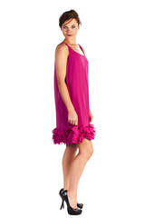 Young and sexy woman model in pink dress posing