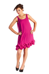 Young and sexy woman model in pink dress posing