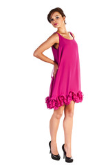 Young and sexy woman model in pink dress posing