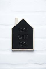 House shaped wooden sign HOME SWEET HOME