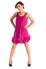 Young and sexy woman model in pink dress posing