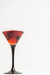 Red cocktail with raspberry