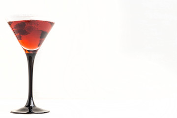 Red cocktail with raspberry
