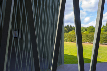 Fence in a park in sunlight in summer