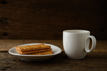 coffee cup with biscuit