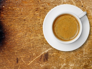 Coffee cup on old wood