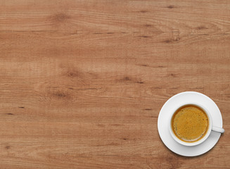 Coffee cup on wood