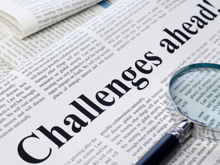 Obraz premium Challenges ahead headline on newspaper