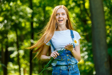 Beautiful smiling red-haired young woman