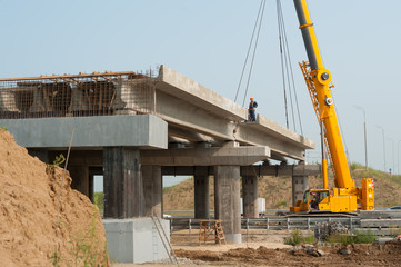 Workers mount bridge span