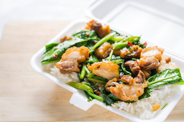 Crispy pork Stir-fried kale with steamed rice in Styrofoam food
