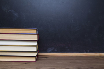 blackboard and books on desk