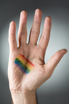 Man's Hand with Rainbow Painted on Its Palm