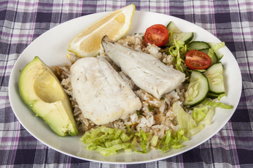 Hake on Fried Jasmine Rice with Lemon, Avocado and Salad