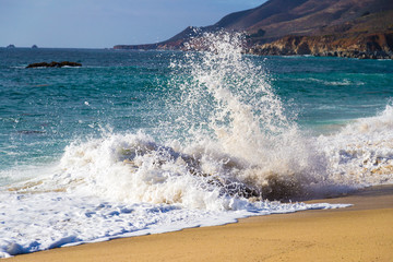 Crushing wave on beach at Garrapata State Beach in Big Sur, California