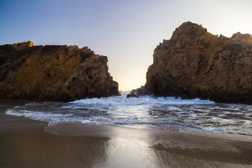 Sunset among two rocks at Pfeiffer State Park, Big Sur, California