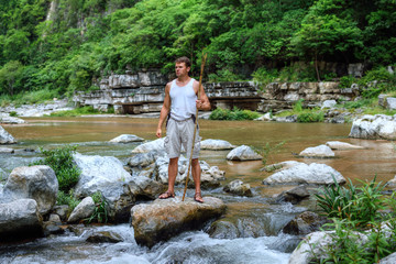 Survivor man in jungle river