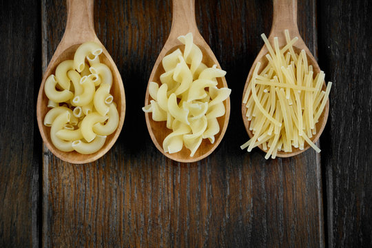 Tree spoons with different kinds of pasta