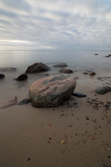 Sunrise over the sea. Beautiful long exposure landscape of rocky shore