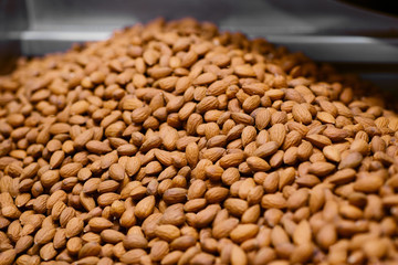 Nuts almonds. Focus in the center of the frame.