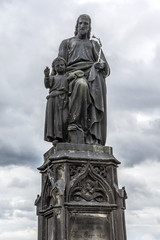 Fototapeta na wymiar Statue on Charles Bridge (Karluv most, 1357). Prague, Czech Rep.