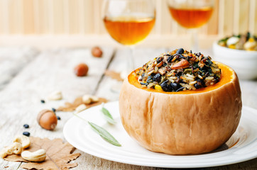 pumpkin stuffed with rice, black beans, corn, cashews and mushro