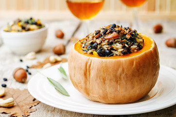 pumpkin stuffed with rice, black beans, corn, cashews and mushro