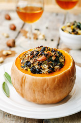 pumpkin stuffed with rice, black beans, corn, cashews and mushro