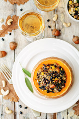 pumpkin stuffed with rice, black beans, corn, cashews and mushro