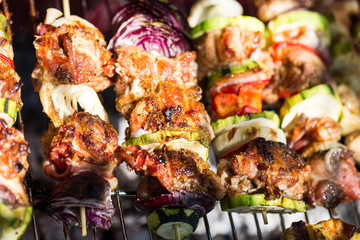 BBQ with fiery sausages on the grill