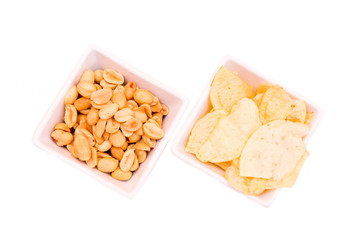 Square bowls of pretzels on a white background seen from above