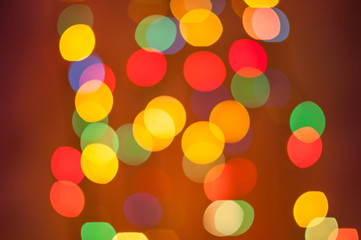 Red and orange holiday bokeh. Abstract blurred Christmas
