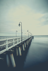 Gdynia Orlowo pier. Vintage photo of Baltic sea shore seascape.