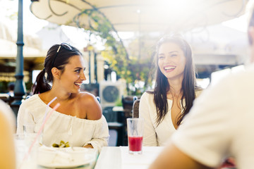 Two young girls talking during lunch break