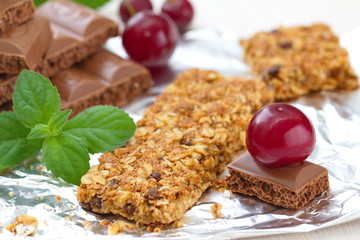 Cereal bars of granola with cherry and chocolate