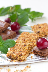 Cereal bars of granola with cherry and chocolate