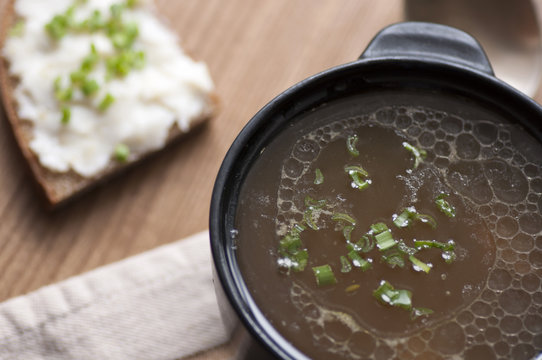Mushroom soup served with lard spread with green onion